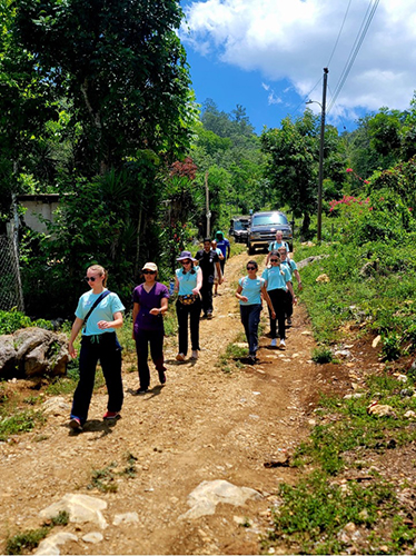 Walking a dirt path to a mobile medical clinic in Honduras